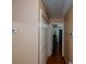 Hallway showing access to bedrooms and living areas at 1712 Graystone Dr, Hampton, GA 30228