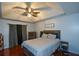 Main bedroom with ceiling fan and wood floors at 1712 Graystone Dr, Hampton, GA 30228