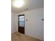 Empty bedroom with tan carpet and brown curtains at 1712 Graystone Dr, Hampton, GA 30228