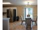 Dining area with glass table and four chairs, near kitchen at 1712 Graystone Dr, Hampton, GA 30228