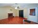 Living room with hardwood floors, fireplace and door to backyard at 1712 Graystone Dr, Hampton, GA 30228