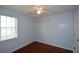 Bedroom with ceiling fan and hardwood floors at 1712 Graystone Dr, Hampton, GA 30228