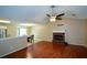 Spacious living room featuring hardwood floors and a brick fireplace at 1712 Graystone Dr, Hampton, GA 30228