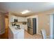 Modern kitchen with stainless steel appliances and white cabinets at 1712 Graystone Dr, Hampton, GA 30228