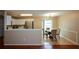 Dining area with glass table and four chairs, near kitchen at 1712 Graystone Dr, Hampton, GA 30228