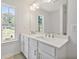 Double vanity bathroom with a large mirror at 2126 Seavey Dr, Decatur, GA 30032