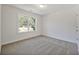 Bright bedroom with carpeted floor and large window at 2126 Seavey Dr, Decatur, GA 30032