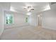 Spacious bedroom with ceiling fan and carpet flooring at 2126 Seavey Dr, Decatur, GA 30032