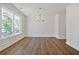 Formal dining room with hardwood floors and chandelier at 2126 Seavey Dr, Decatur, GA 30032