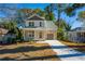 Two-story house with gray accents, front porch, and driveway at 2126 Seavey Dr, Decatur, GA 30032