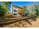 Back of house with deck and large backyard at 2126 Seavey Dr, Decatur, GA 30032
