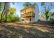 Back of house with deck and large backyard at 2126 Seavey Dr, Decatur, GA 30032