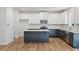 Modern kitchen featuring granite countertops and two-toned cabinetry at 2126 Seavey Dr, Decatur, GA 30032