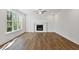 Living room with hardwood floors, fireplace and ceiling fan at 2126 Seavey Dr, Decatur, GA 30032