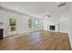 Spacious living room with hardwood floors, fireplace and large windows at 2126 Seavey Dr, Decatur, GA 30032