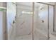 Walk-in shower with marble tile and built-in seat at 2126 Seavey Dr, Decatur, GA 30032