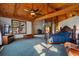 Main bedroom with a king-size bed, high ceilings, and large windows offering abundant natural light at 5185 Buice Rd, Alpharetta, GA 30022