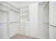 Large walk-in closet with ample storage space, including shelving, drawers, and hanging rods at 600 Jones Rd, Roswell, GA 30075