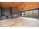 Covered patio with a fireplace, outdoor kitchen, and ceiling fan at 600 Jones Rd, Roswell, GA 30075