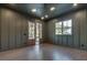 Spacious home office features wood floors, built-in shelving, and French doors at 884 Derrydown Way, Decatur, GA 30030