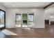 Living room with hardwood floors and multi-panel doors leading to a screened porch at 884 Derrydown Way, Decatur, GA 30030