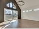 Main bedroom with hardwood floors, dramatic wall, and sliding doors to deck at 884 Derrydown Way, Decatur, GA 30030