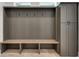 Mudroom with built-in bench, hooks, and cabinets at 884 Derrydown Way, Decatur, GA 30030