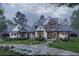 Stunning two-story farmhouse with gray siding, large windows and landscaping at 234 Aberdeen Way, Woodstock, GA 30188