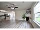 Bright living room with fireplace and hardwood floors at 617 Armitage Way, Stockbridge, GA 30281