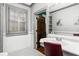 Elegant bathroom with subway tile, a patterned floor, and a vanity with a vessel sink at 2516 Alston Se Dr, Atlanta, GA 30317