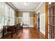 Bright home office features hardwood floors, built-in shelving, and plantation shutters at 2516 Alston Se Dr, Atlanta, GA 30317