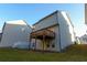 Two story home with deck, backyard, and landscaping at 573 Auburn Crossing Dr, Auburn, GA 30011