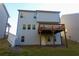 Two story home with deck, backyard, and landscaping at 573 Auburn Crossing Dr, Auburn, GA 30011