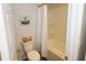 Bathroom with tub, shower, and neutral color palette at 573 Auburn Crossing Dr, Auburn, GA 30011