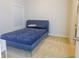 Bright bedroom with a blue bed frame and carpet at 573 Auburn Crossing Dr, Auburn, GA 30011