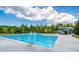 Community pool with water features and slide at 573 Auburn Crossing Dr, Auburn, GA 30011