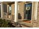 Dark-stained front door with a white floral wreath at 573 Auburn Crossing Dr, Auburn, GA 30011