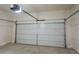 Attached garage with an automatic door opener at 573 Auburn Crossing Dr, Auburn, GA 30011