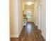 Long hallway with wood-look floors and access to rooms at 573 Auburn Crossing Dr, Auburn, GA 30011