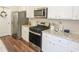 Well-equipped kitchen with stainless steel appliances and granite countertops at 573 Auburn Crossing Dr, Auburn, GA 30011