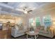 Spacious living room with coffered ceiling and comfortable seating at 573 Auburn Crossing Dr, Auburn, GA 30011