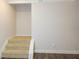 Carpeted staircase leading to the upper level at 573 Auburn Crossing Dr, Auburn, GA 30011