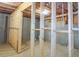 Unfinished basement with framed walls and utilities at 573 Auburn Crossing Dr, Auburn, GA 30011