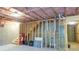 Unfinished basement area with exposed utilities at 573 Auburn Crossing Dr, Auburn, GA 30011