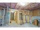 Unfinished basement with framed rooms and storage at 573 Auburn Crossing Dr, Auburn, GA 30011