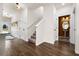 Bright entry hall with hardwood floors, powder room, and staircase at 520 Lanier Way, Temple, GA 30179