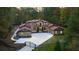 Luxury home with stone and stucco exterior, gated entry, and large driveway at 1416 Walcutts Nw Way, Marietta, GA 30064