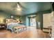 Main bedroom with king-size bed, private exit to backyard, and an en-suite bathroom at 134 N Johnson St, Newborn, GA 30056