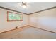 Well-lit bedroom with carpeted floors and ceiling fan at 3636 Anneewakee Rd, Douglasville, GA 30135