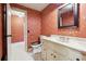 Charming bathroom with floral wallpaper and updated vanity at 5417 Trentham Dr, Dunwoody, GA 30338